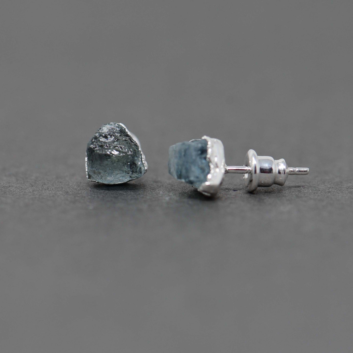 Silver stud earrings with Rough Aquamarine