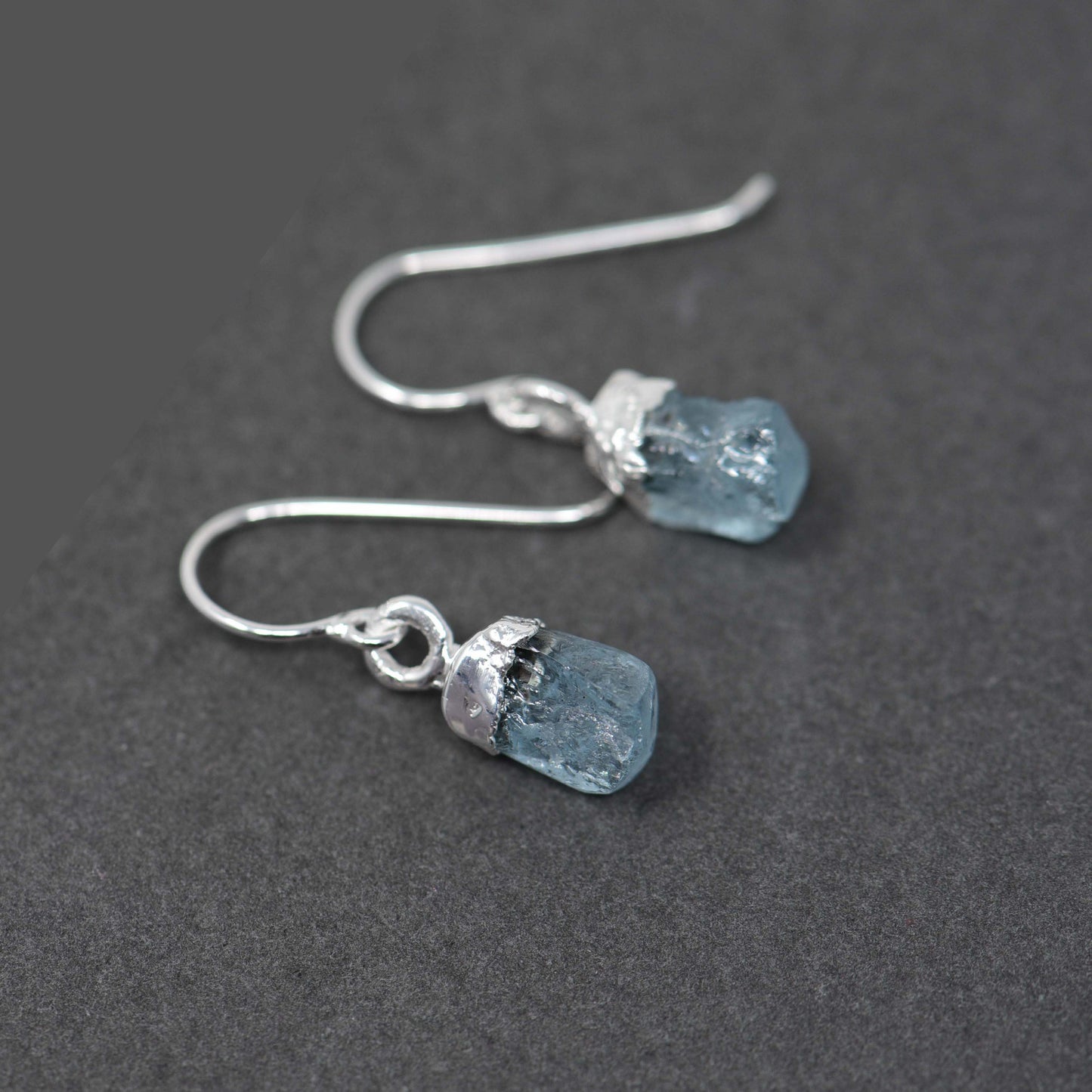 Silver hook earrings with Rough Aquamarine
